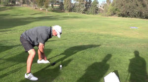 Gary McCord and Dan Boever mess around with a very short driver on the driving range